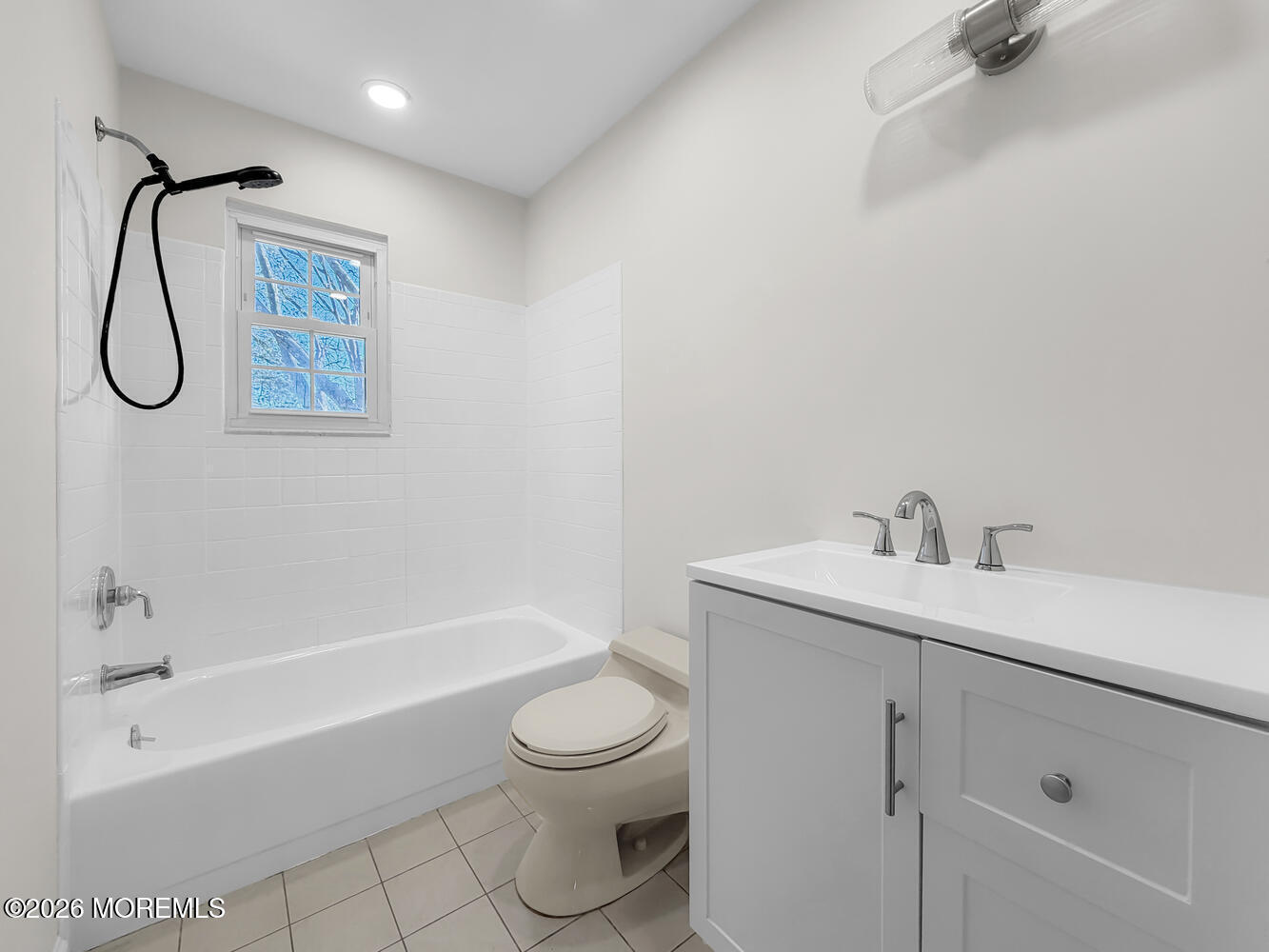 7 Meadow Court Hazlet, NJ 07730 - Photo 43 of 68 a bathroom with a toilet sink vanity tub and shower