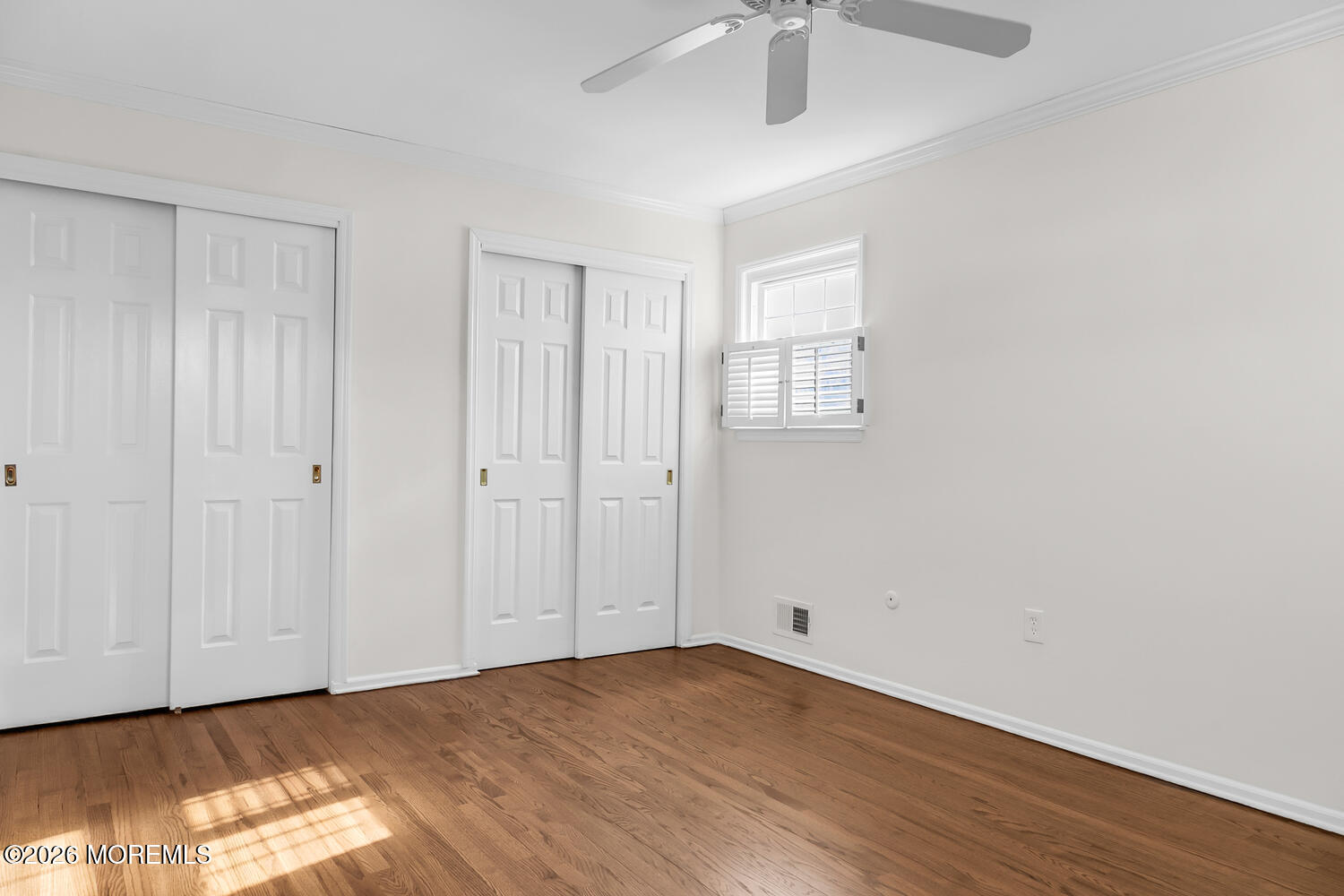 7 Meadow Court Hazlet, NJ 07730 - Photo 50 of 68 a view of an empty room with wooden floor