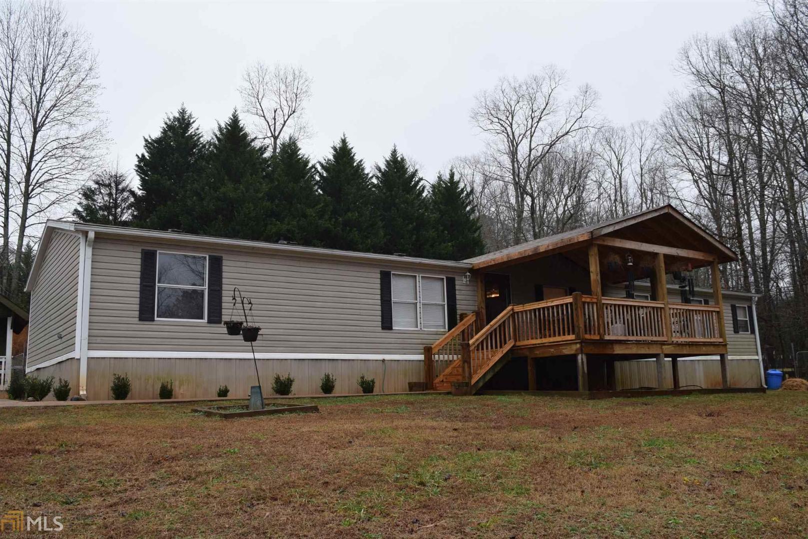 171 Henderson Road Cleveland, GA 30528 - Photo 1 of 1 a front view of a house with a yard