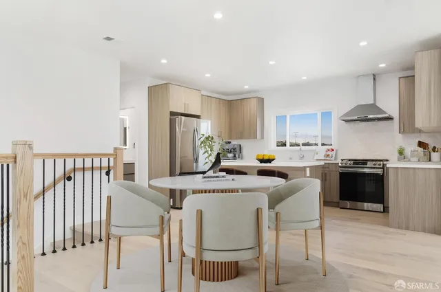 a kitchen with a stove a sink and a refrigerator