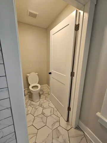a bathroom with a sink and a toilet