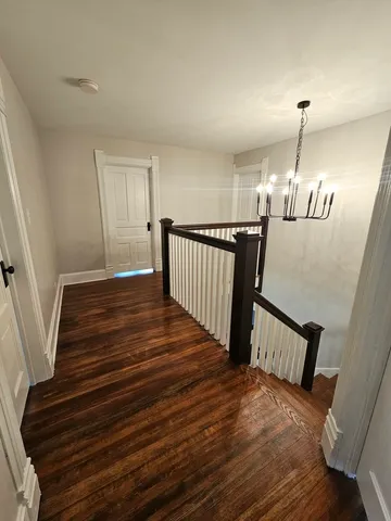 a view of entryway livingroom and hallway with wooden floor