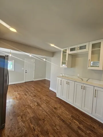 a view of a livingroom with wooden floor