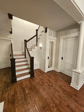 a view of entryway with wooden floor