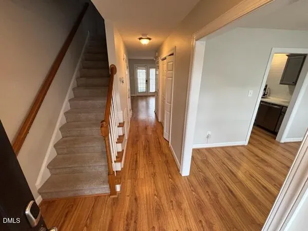 a view of entryway with wooden floor