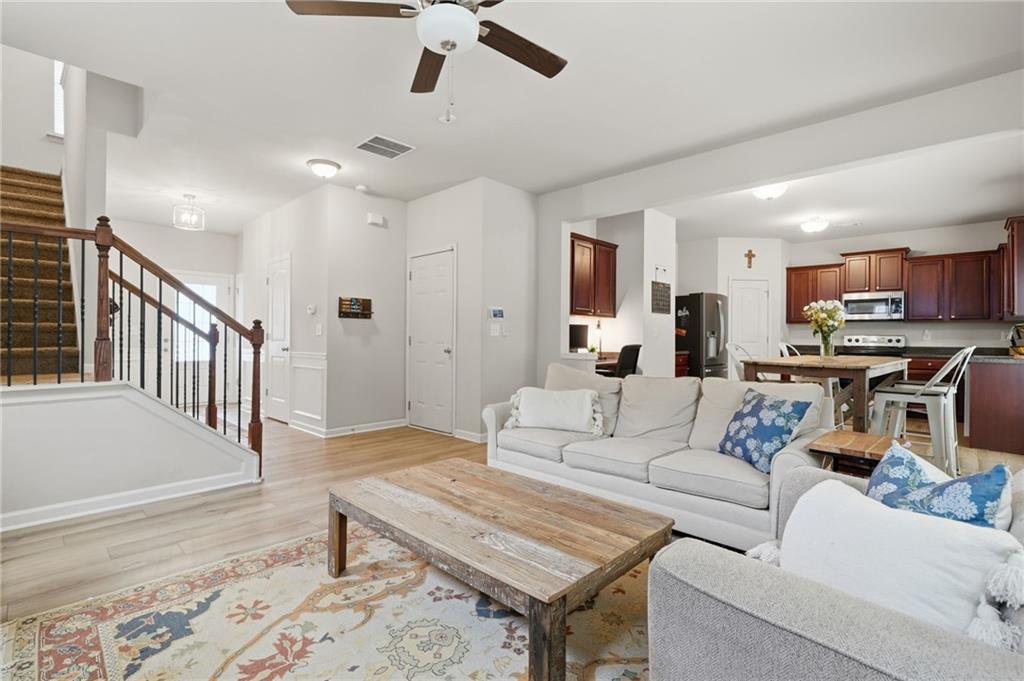 123 Renford Road Ball Ground, GA 30107 - Photo 7 of 27 a living room with furniture and kitchen view