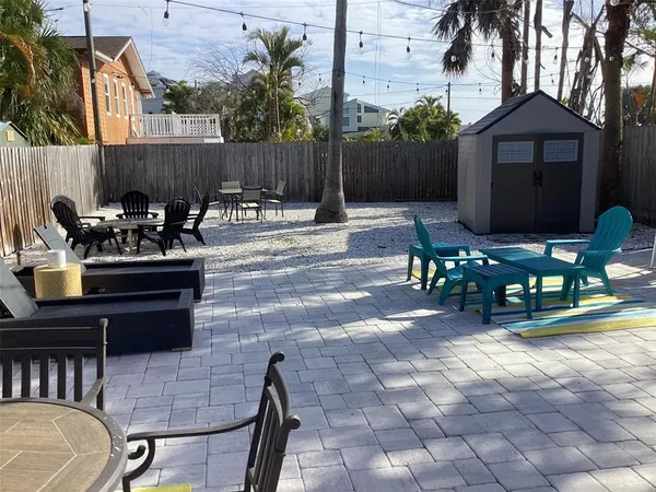 a view of a chairs and tables in the patio