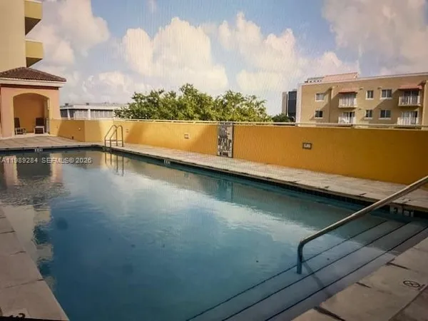 a view of a swimming pool with an ocean view