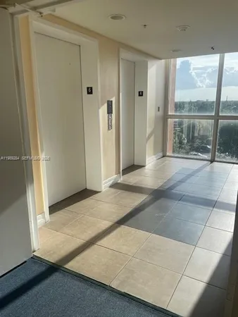 a kitchen with a stove and a refrigerator
