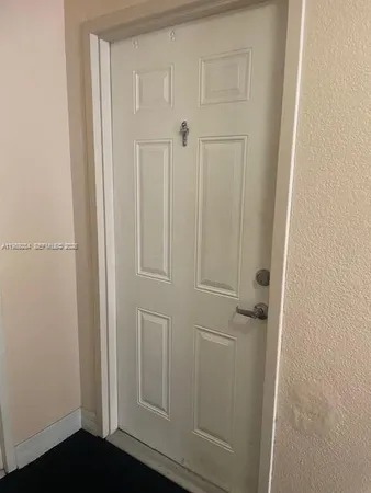 a view of a storage & utility room with a washer dryer