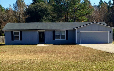 44206 Quail Ridge Avenue East Callahan, FL 32011 - Photo 1 of 15 a house with trees in the background