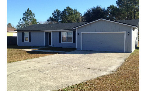 44206 Quail Ridge Avenue East Callahan, FL 32011 - Photo 14 of 15 a front view of a house with a yard