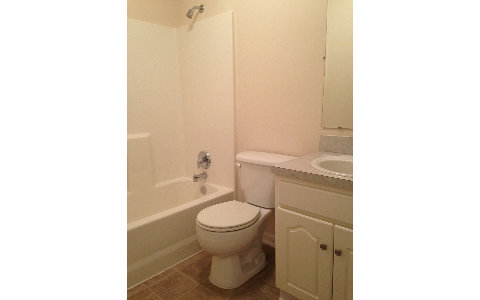 44206 Quail Ridge Avenue East Callahan, FL 32011 - Photo 7 of 15 a bathroom with a toilet and a shower
