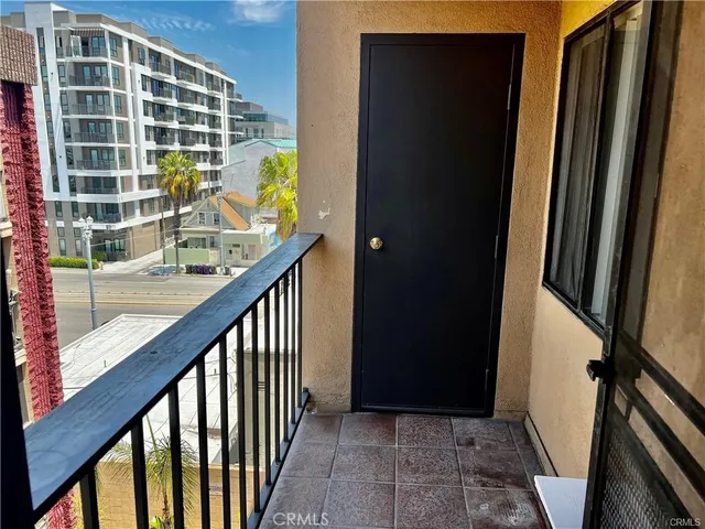 a view of balcony with wooden floor and stairs