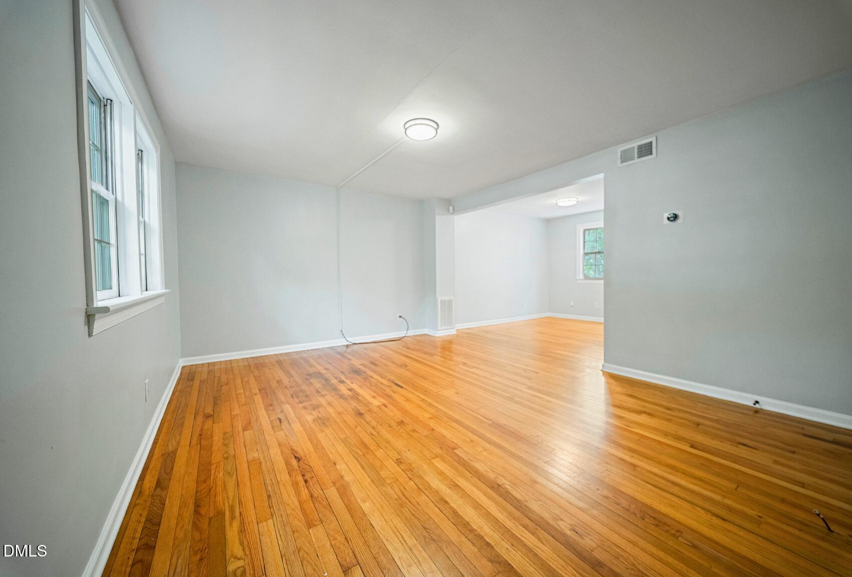 967 St Marys Street Raleigh, NC 27605 - Photo 10 of 34 a view of empty room with wooden floor