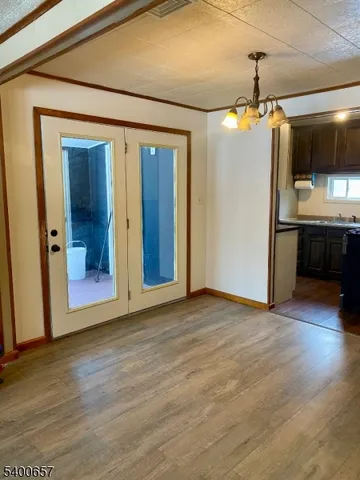a view of a kitchen with a sink and cabinets