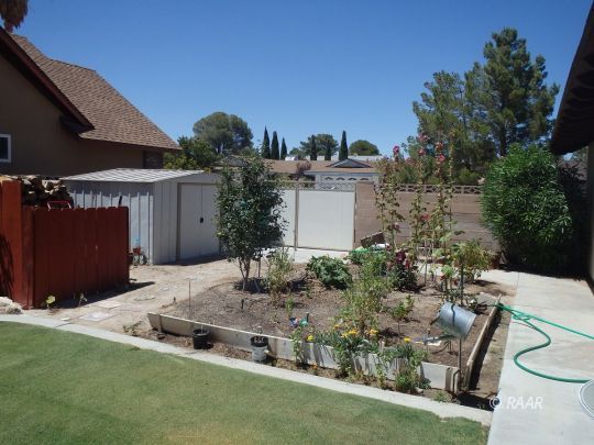 601 North Sierra View Street Ridgecrest, CA 93555 - Photo 31 of 35 a view of a backyard with plants and a patio