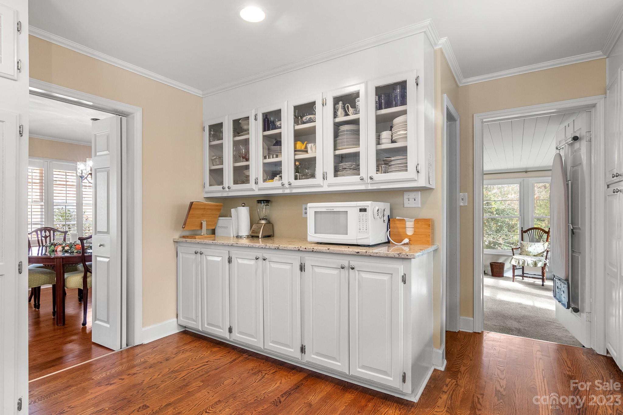 209 Country Club Road Shelby, NC 28150 - Photo 14 of 42 a kitchen with a white cabinets and wooden floor