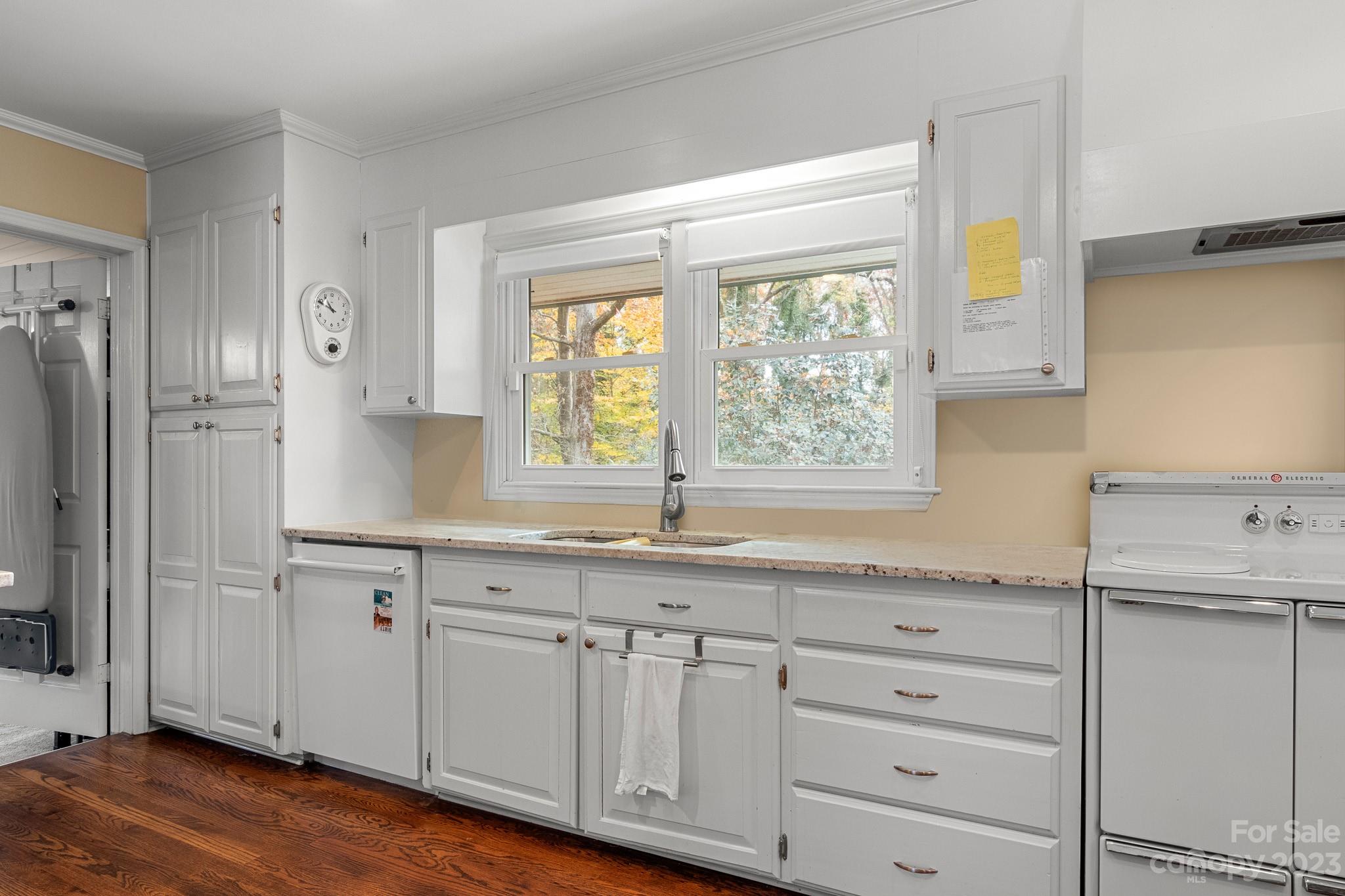 209 Country Club Road Shelby, NC 28150 - Photo 15 of 42 a kitchen with granite countertop white cabinets and a window