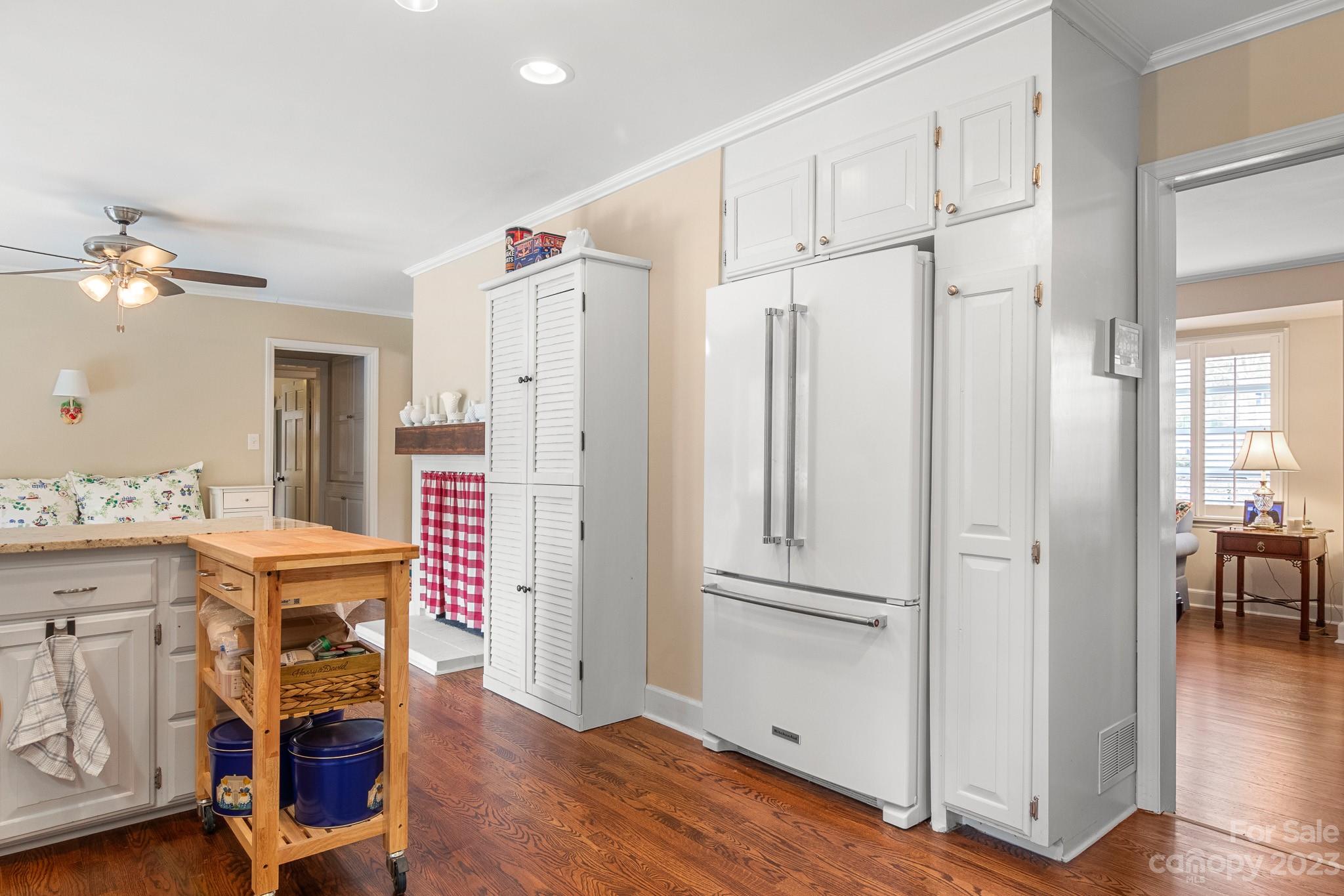209 Country Club Road Shelby, NC 28150 - Photo 16 of 42 a kitchen with stainless steel appliances granite countertop a refrigerator a stove and white cabinets with wooden floor
