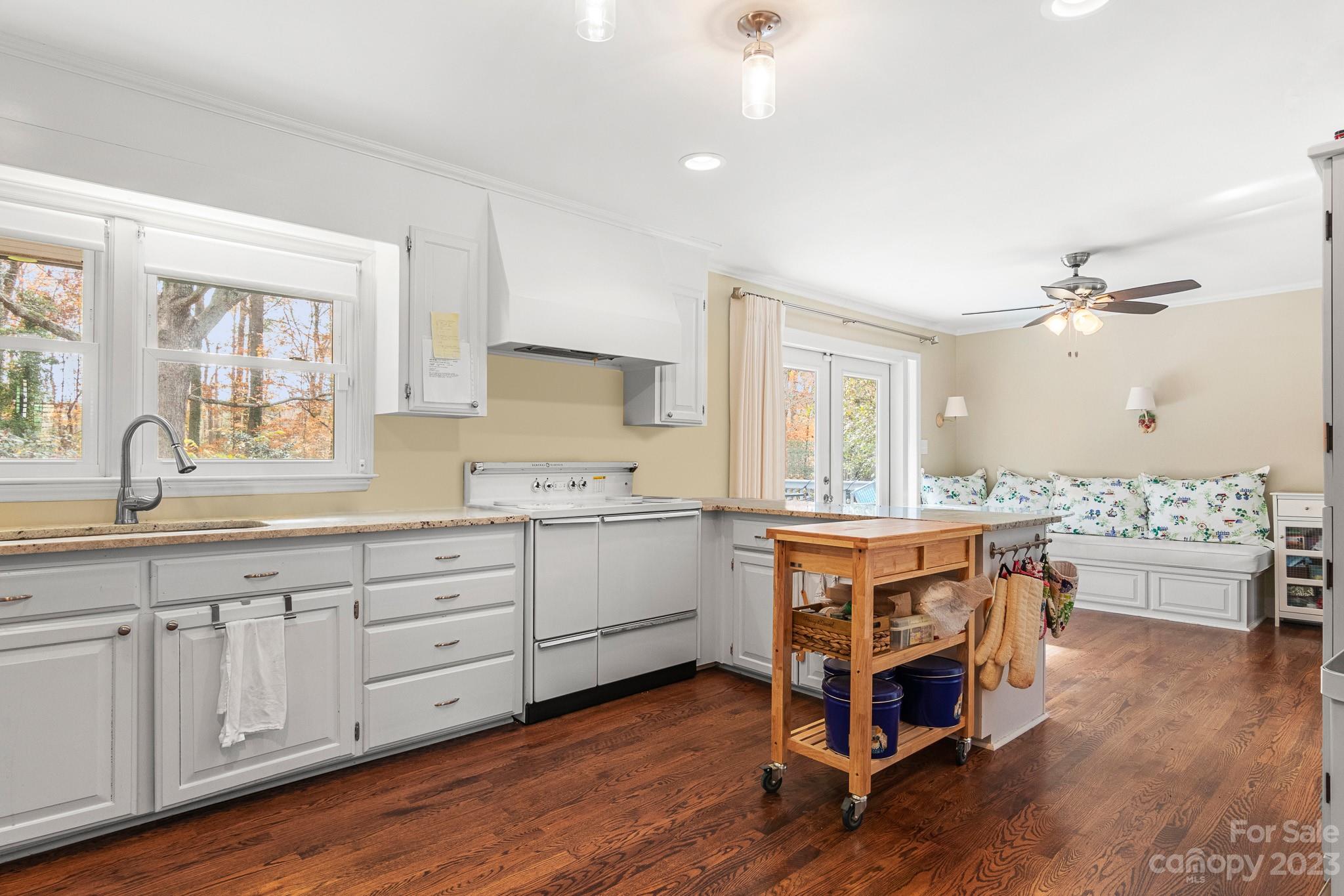 209 Country Club Road Shelby, NC 28150 - Photo 17 of 42 a kitchen with a white cabinets and sink