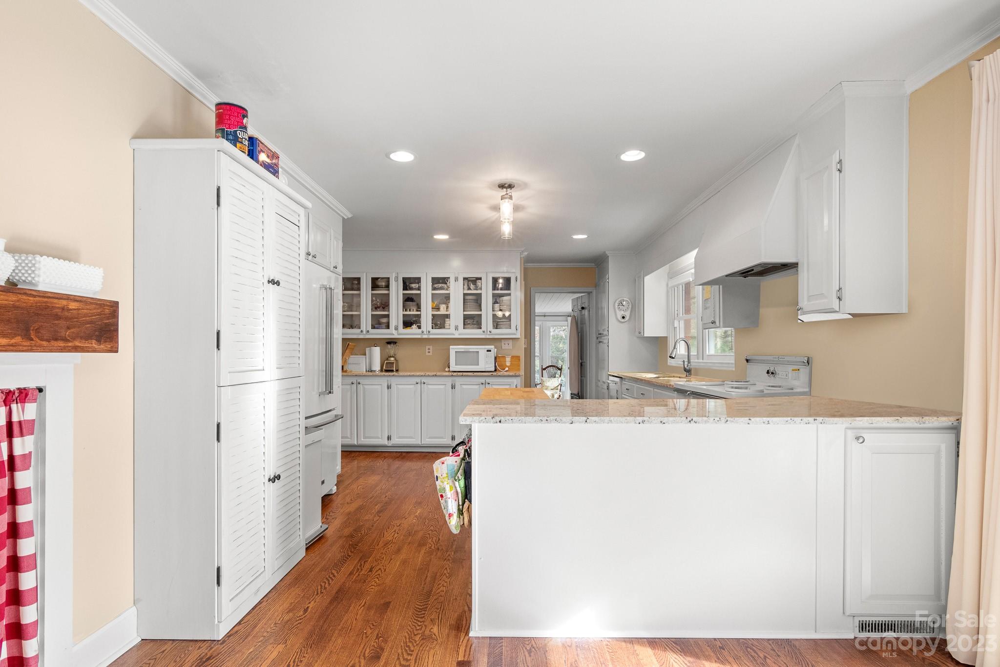 209 Country Club Road Shelby, NC 28150 - Photo 21 of 42 a kitchen with stainless steel appliances granite countertop a refrigerator sink and white cabinets