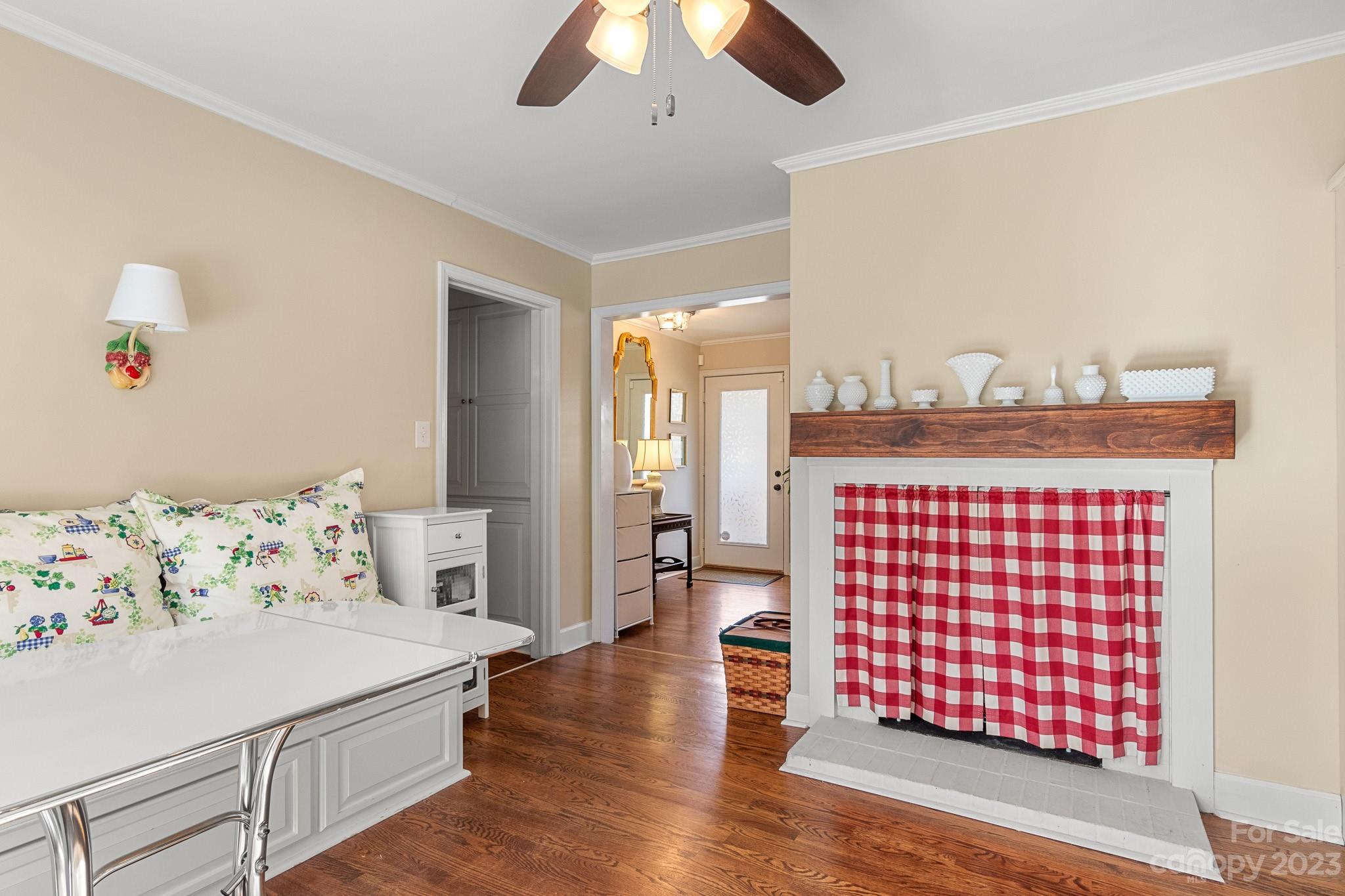 209 Country Club Road Shelby, NC 28150 - Photo 22 of 42 a bedroom with a bed and wooden floor