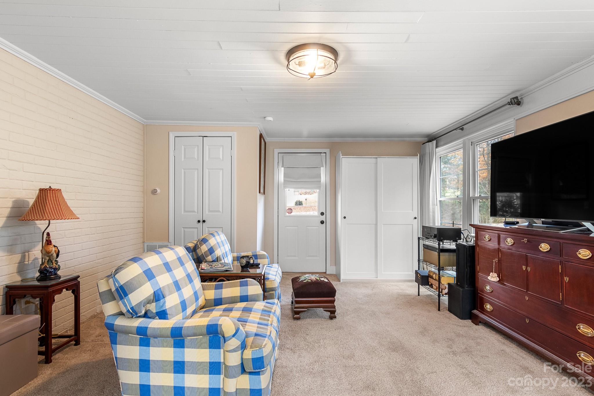 209 Country Club Road Shelby, NC 28150 - Photo 32 of 42 a bedroom with furniture and a flat screen tv