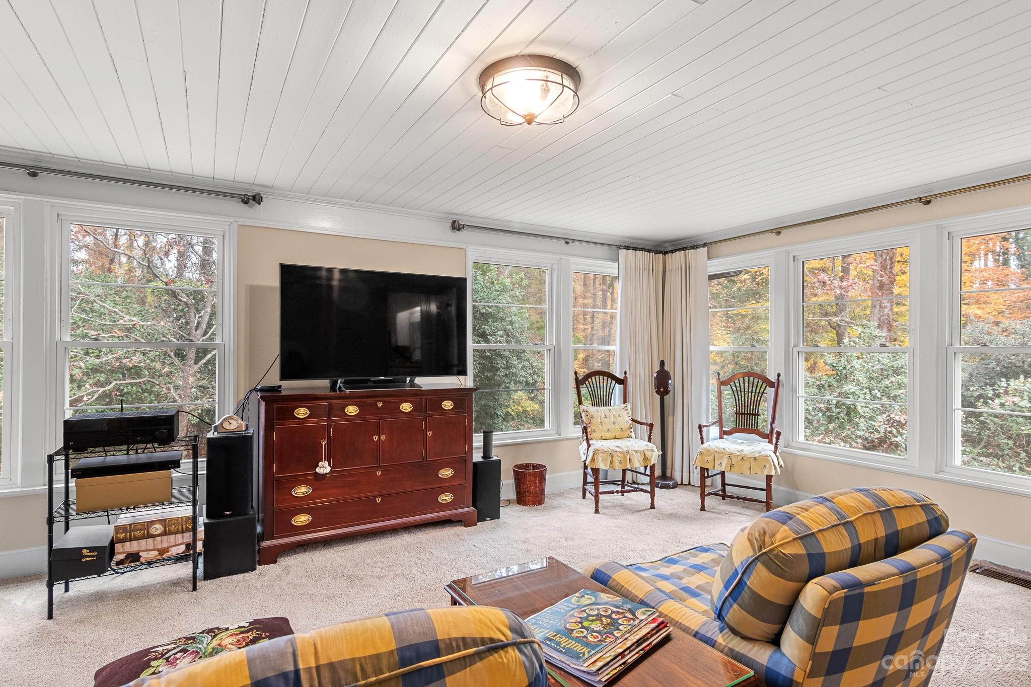 209 Country Club Road Shelby, NC 28150 - Photo 33 of 42 a living room with furniture a flat screen tv and a large window