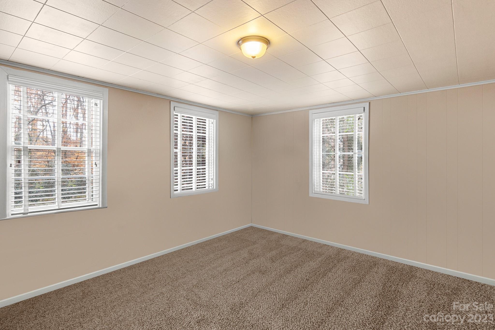 209 Country Club Road Shelby, NC 28150 - Photo 34 of 42 an empty room with windows