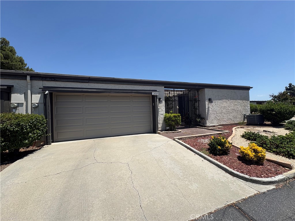 26168 Birkdale Road Menifee, CA 92586 - Photo 2 of 15 a backyard of a house with yard and outdoor seating