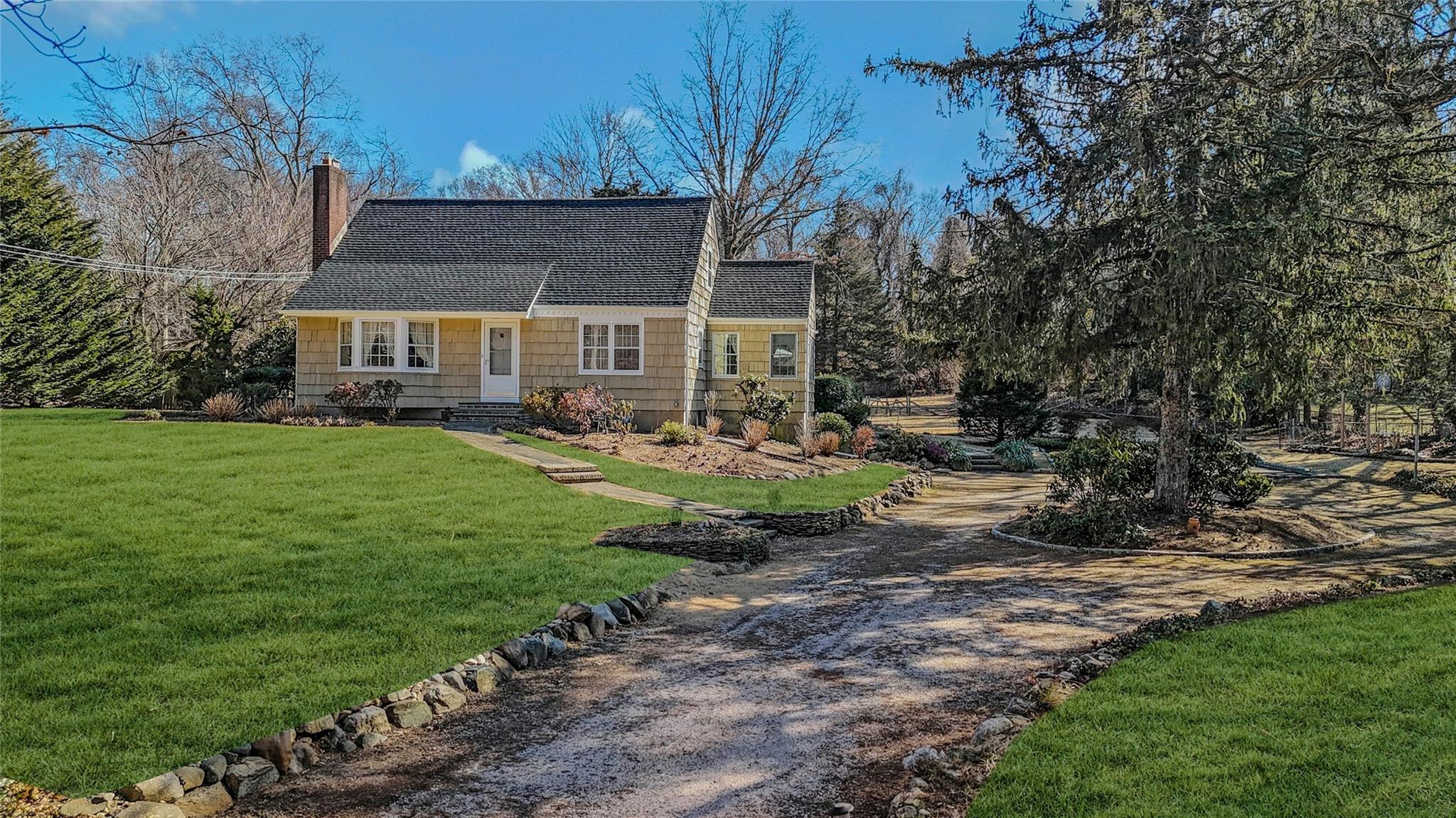 a view of house with yard