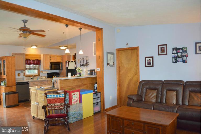 116 Rambo Court Linden, VA 22642 - Photo 15 of 30 a living room with stainless steel appliances kitchen island granite countertop furniture and a view of kitchen