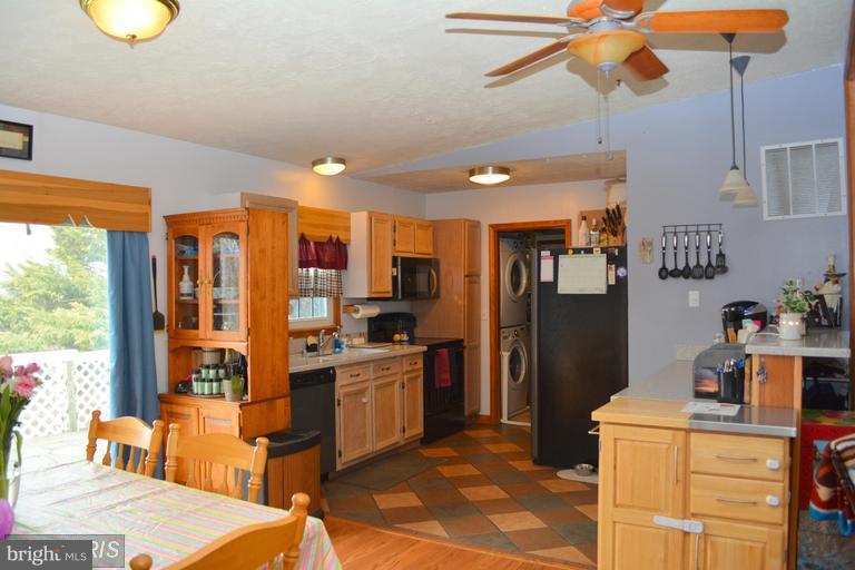 116 Rambo Court Linden, VA 22642 - Photo 16 of 30 a kitchen with stainless steel appliances granite countertop a sink refrigerator and cabinets