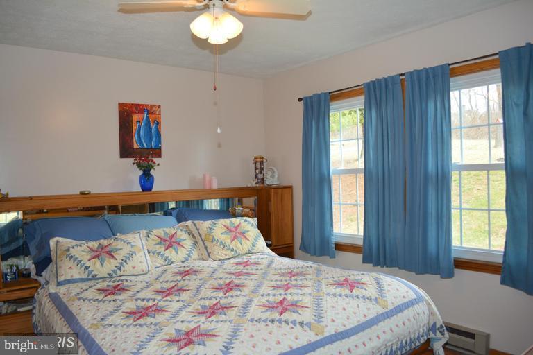 116 Rambo Court Linden, VA 22642 - Photo 19 of 30 a bedroom with a bed and a window