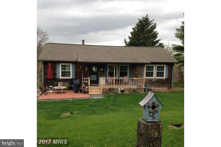 116 Rambo Court Linden, VA 22642 - Photo 3 of 30 a front view of a house with garden and sitting area