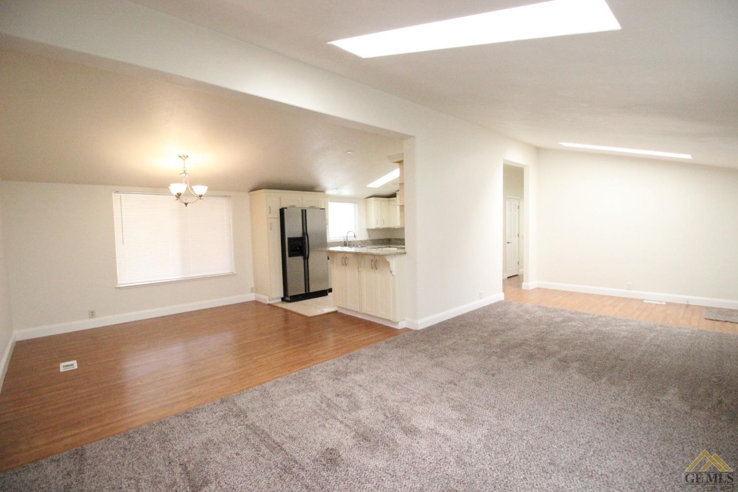 Undisclosed Address Bakersfield, CA 93308 - Photo 12 of 26 an empty room with windows and pillars in it