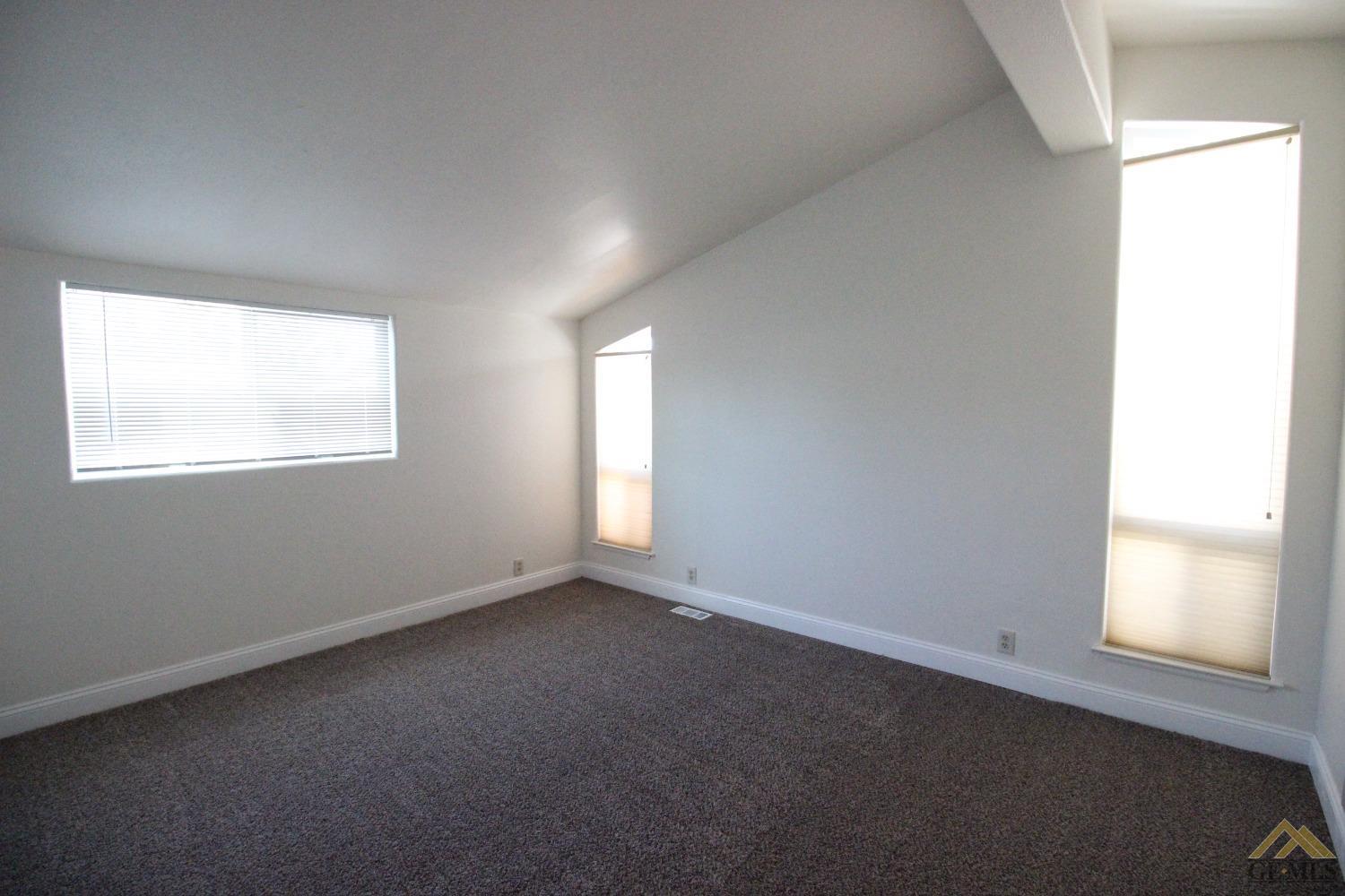 Undisclosed Address Bakersfield, CA 93308 - Photo 17 of 26 an empty room with a window