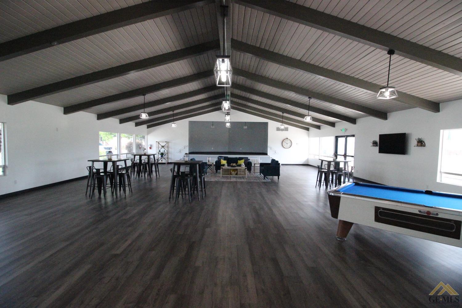 Undisclosed Address Bakersfield, CA 93308 - Photo 21 of 26 a view of a livingroom with furniture and a kitchen