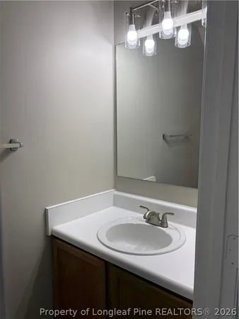 a utility room with sink a washer and dryer