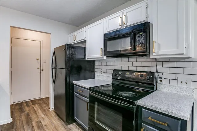 a kitchen with a stove microwave and refrigerator