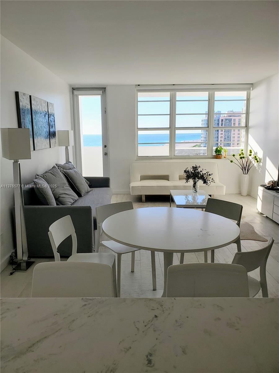 100 Lincoln Road, Unit 1244 Miami Beach, FL 33139 - Photo 14 of 68 a living room with furniture and a large window
