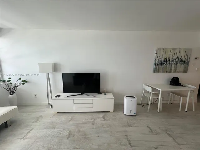 a kitchen with stainless steel appliances a refrigerator and a sink