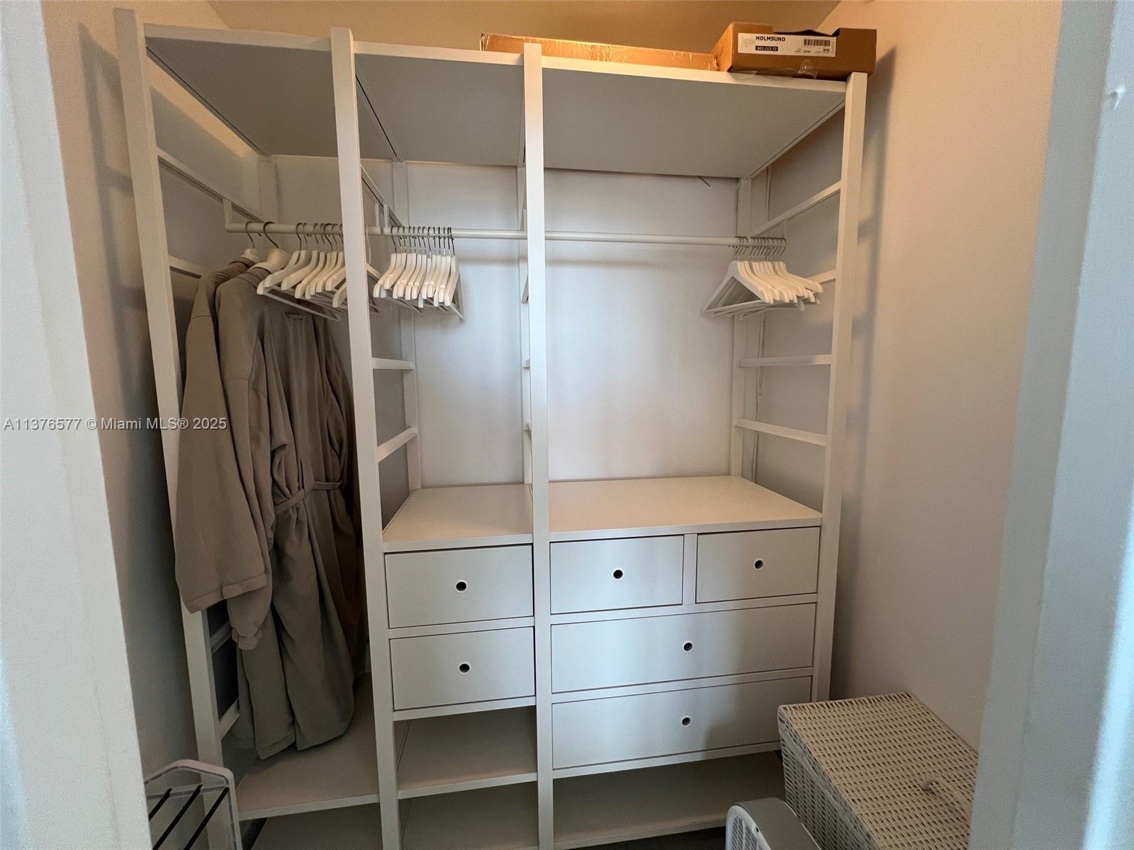 100 Lincoln Road, Unit 1244 Miami Beach, FL 33139 - Photo 28 of 68 a view of walk in closet with clothes and shoes