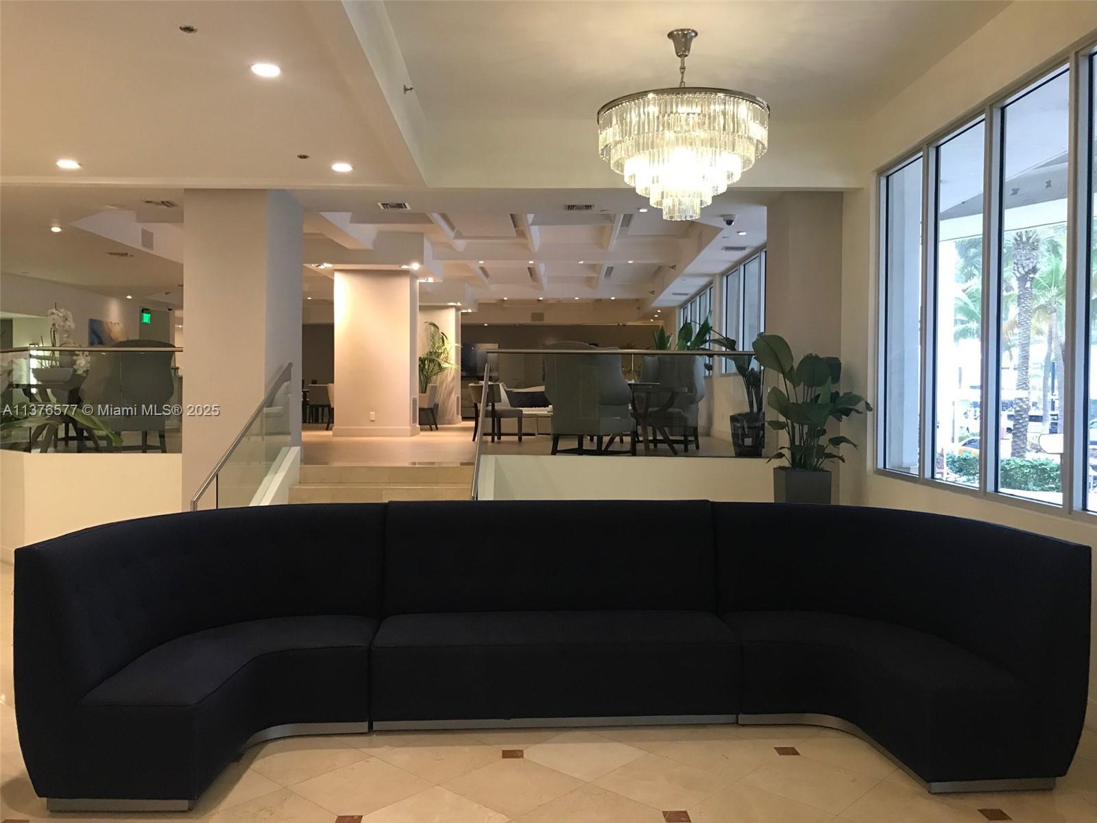 100 Lincoln Road, Unit 1244 Miami Beach, FL 33139 - Photo 34 of 68 a view of a living room and chandelier