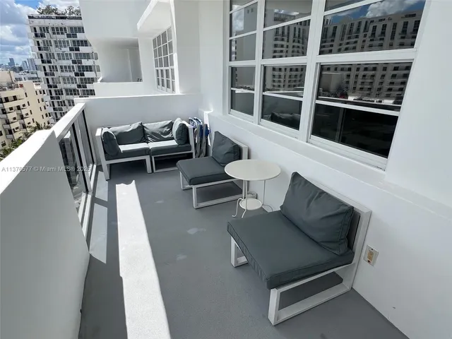 a view of a balcony with chairs