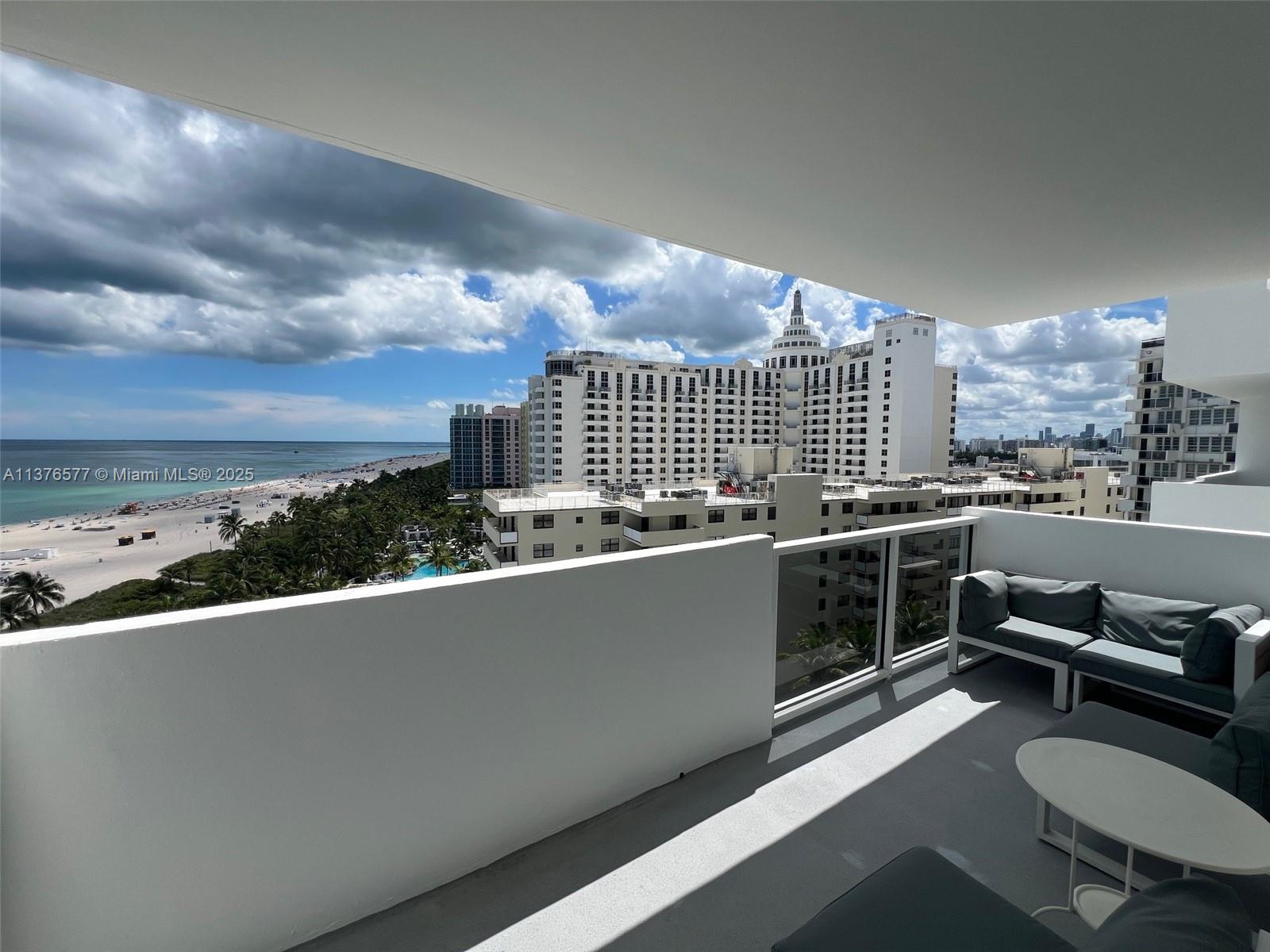 100 Lincoln Road, Unit 1244 Miami Beach, FL 33139 - Photo 6 of 68 a view of a balcony with chairs