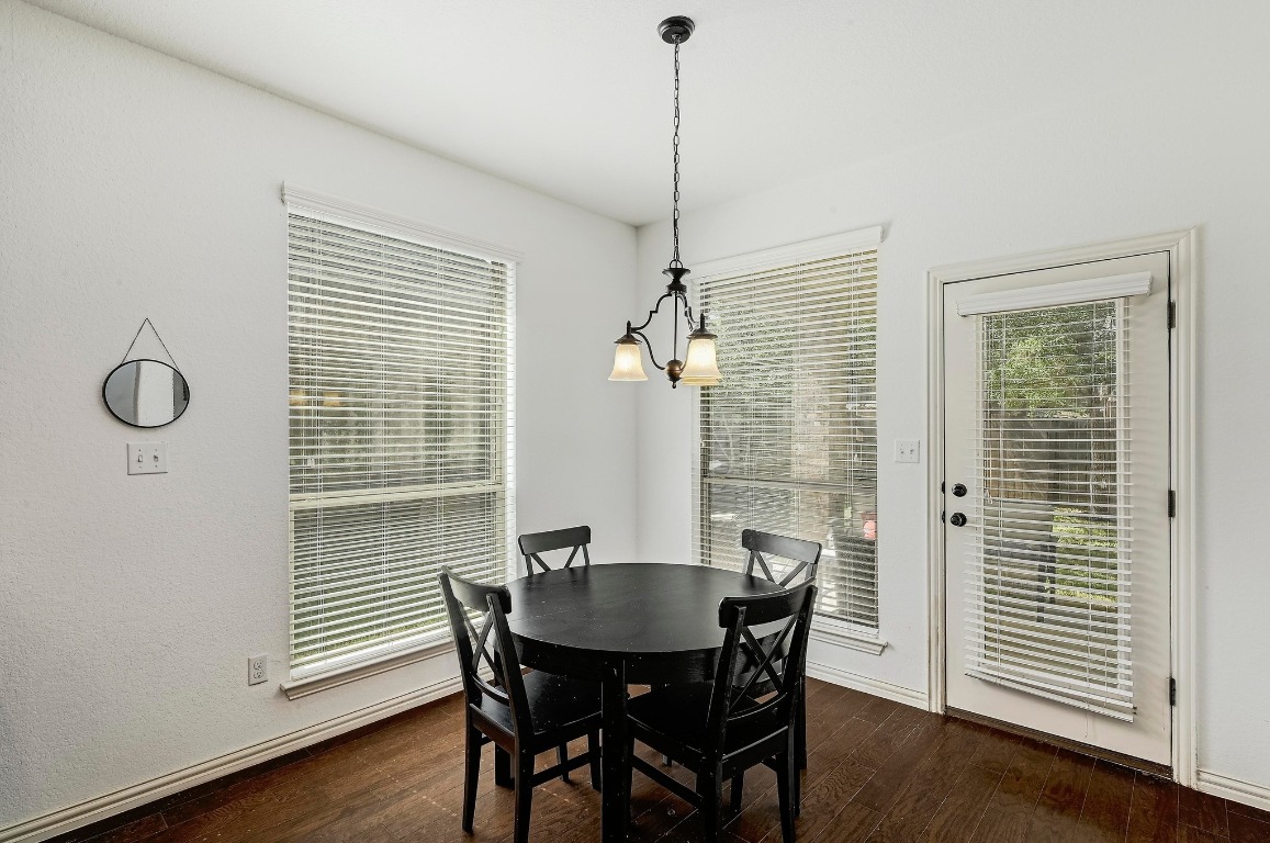 2229 Turtle Mountain Bend Austin, TX 78748 - Photo 13 of 38 a view of a dining room with furniture window and wooden floor