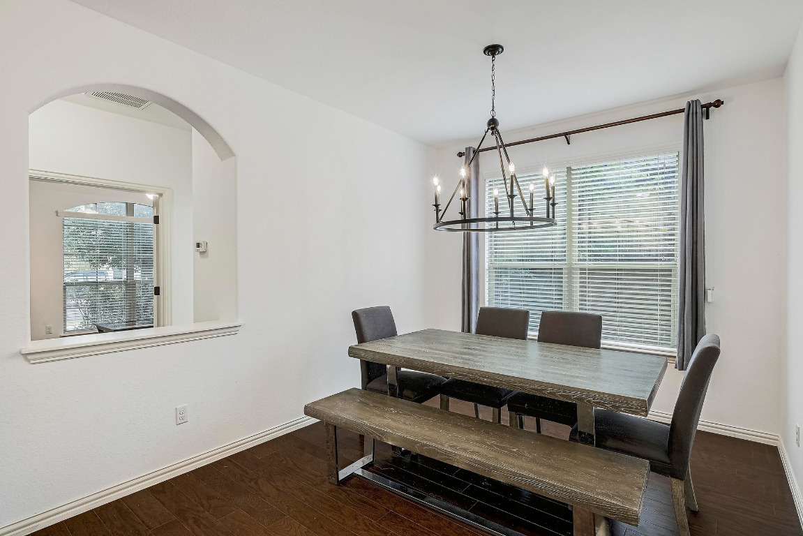 2229 Turtle Mountain Bend Austin, TX 78748 - Photo 15 of 38 a view of a dining room with furniture window and wooden floor