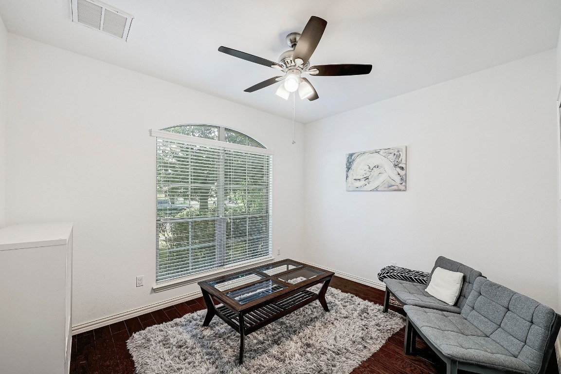 2229 Turtle Mountain Bend Austin, TX 78748 - Photo 21 of 38 a living room with a bed furniture and a window